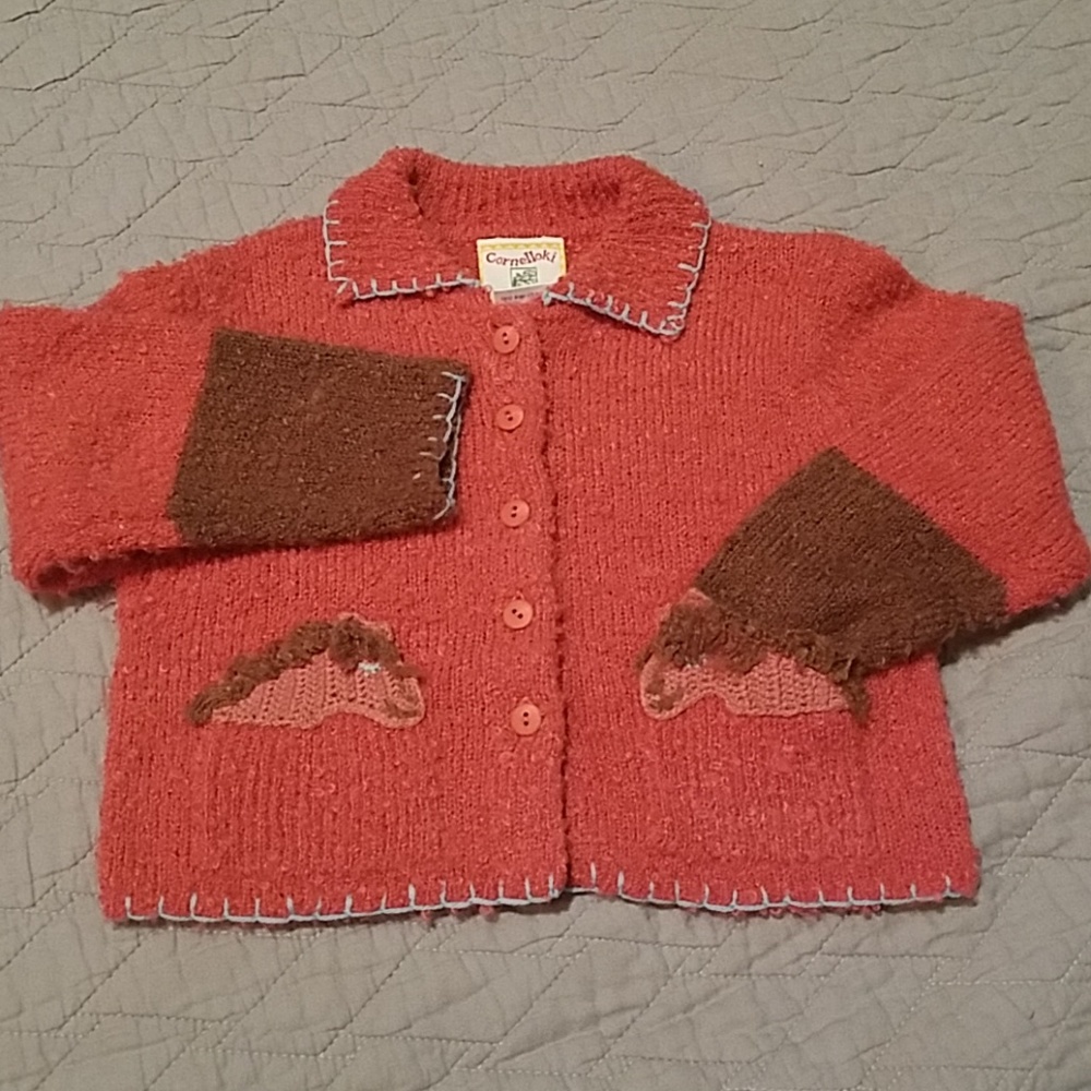 Sweater with horsey pockets. Size 2